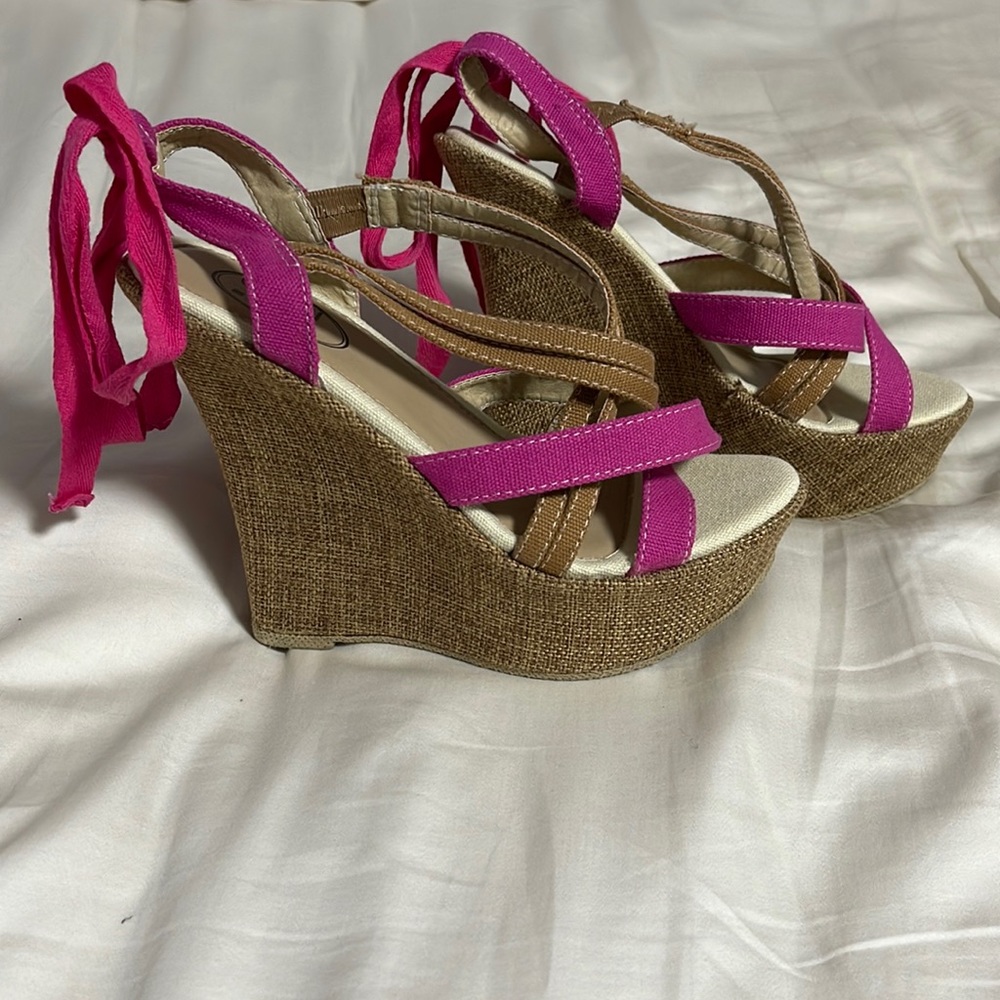 Women’s brown wedges with pink accents.